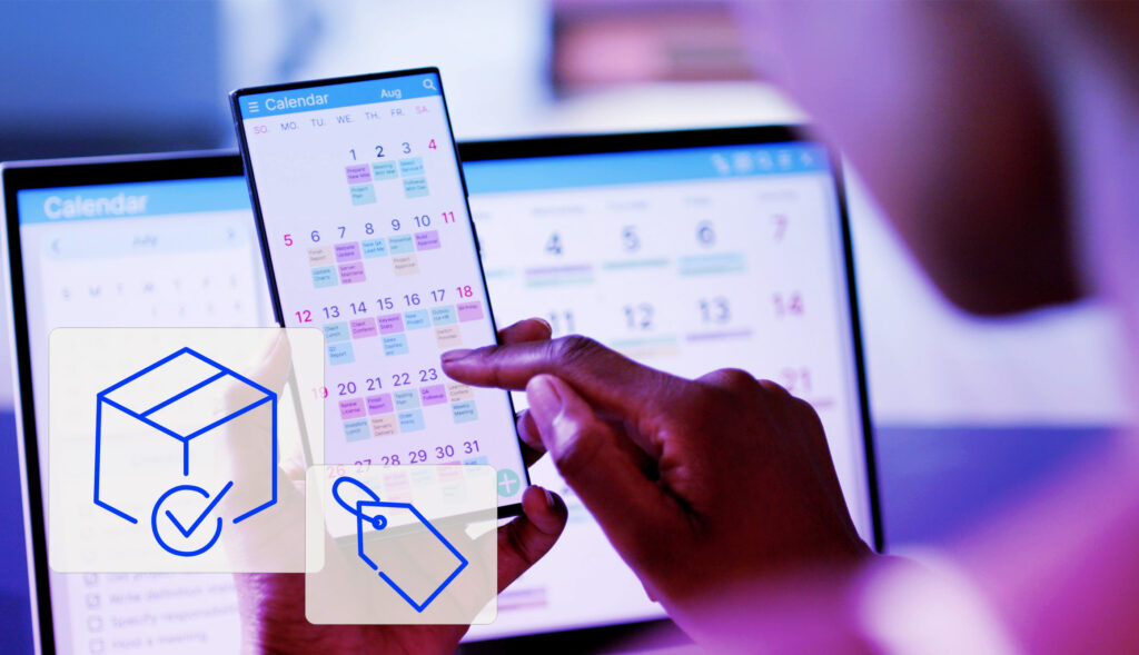Close-up of a person using a digital calendar app on a smartphone, with a laptop displaying a similar calendar in the background. Overlay icons show a cube with a check mark and a price tag, suggesting product planning and seasonal sales scheduling.