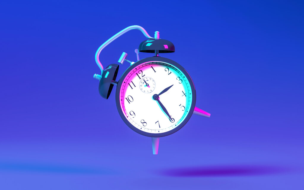 A classic analog alarm clock with two bells, floating against a blue and purple gradient background.
